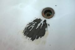 Damaged Tub Next To Drain